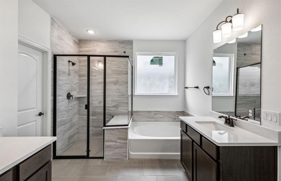 Owner's bath with oversized shower and tub*real home pictured