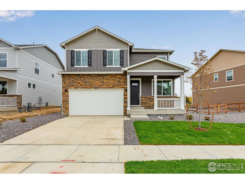 Front exterior of a new home in Hansen Farm, Fort Collins, CO, highlighting curb appeal (Image 2). Front exterior of a new home in Hansen Farm, Fort Collins, CO, highlighting curb appeal (Image 2).