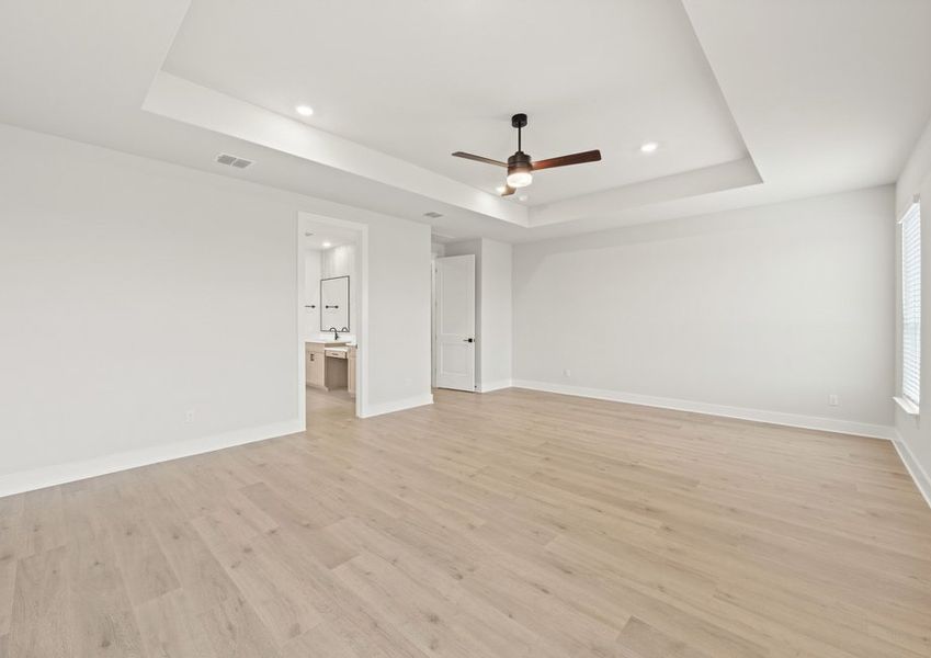 The master suite has a large bedroom, ensuite bathroom and a walk-in closet.