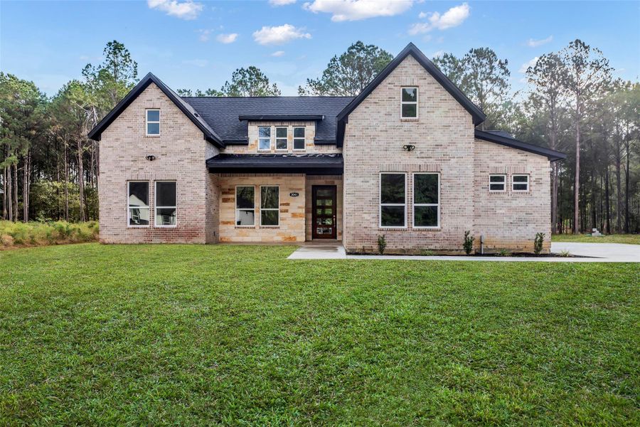 Front exterior of a new home in , Dayton, TX, highlighting curb appeal (Image 1). Front exterior of a new home in , Dayton, TX, highlighting curb appeal (Image 1).