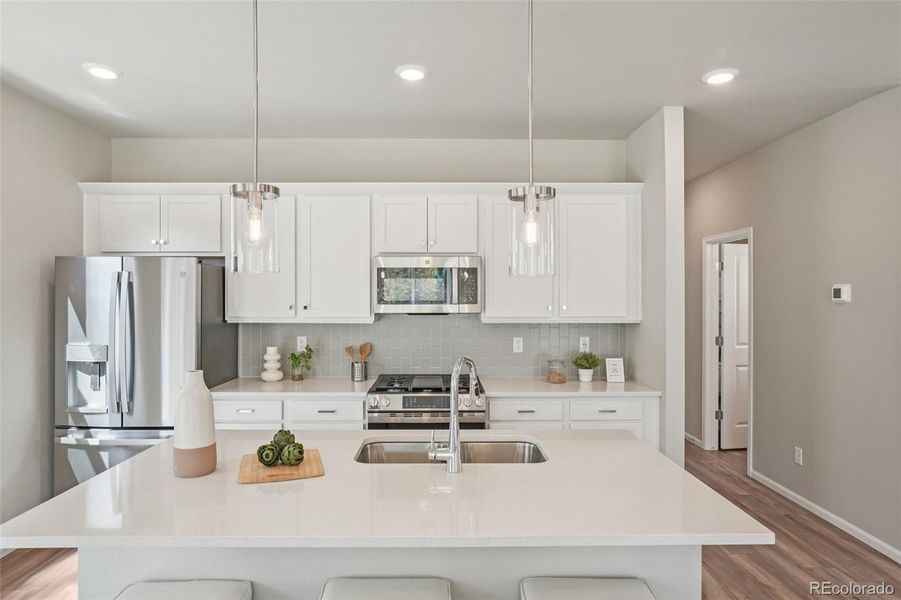 Furnished interior view inside a new home in Woodrose at Painted Prairie, Aurora (Image 5).