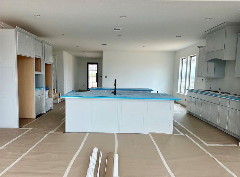 Kitchen featuring a center island and a sink