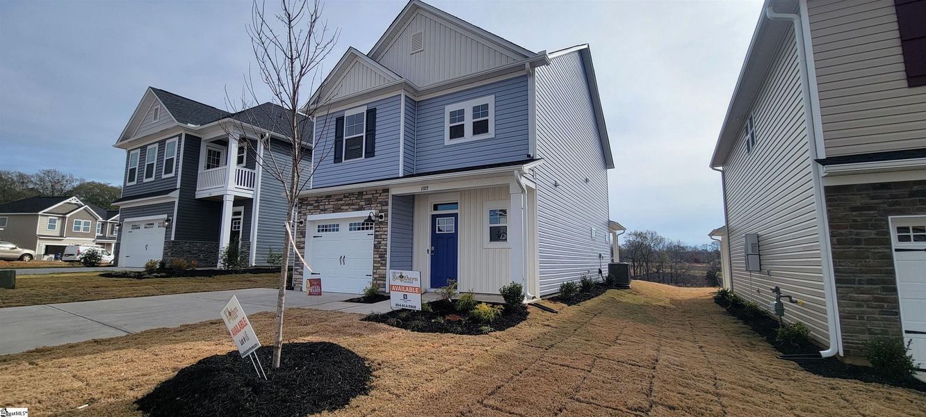 Front exterior of a new home in Halton Oaks, Spartanburg, SC, highlighting curb appeal (Image 17).