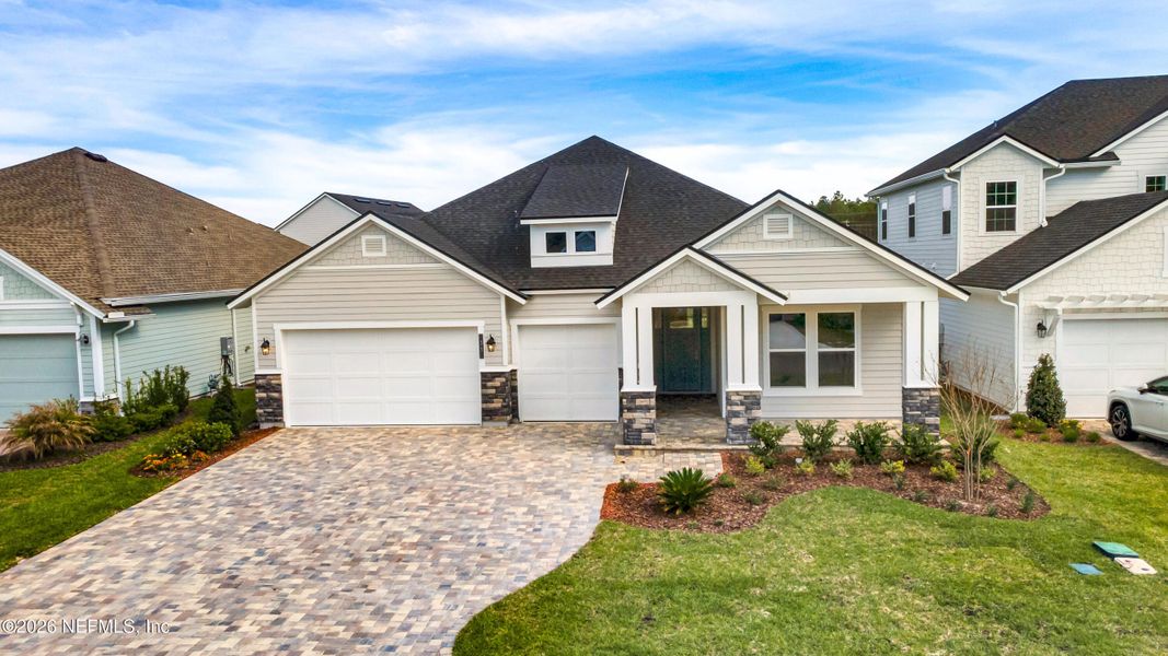 Front exterior of a new home in Middlebourne, St. Johns, FL, highlighting curb appeal (Image 2). Front exterior of a new home in Middlebourne, St. Johns, FL, highlighting curb appeal (Image 2).