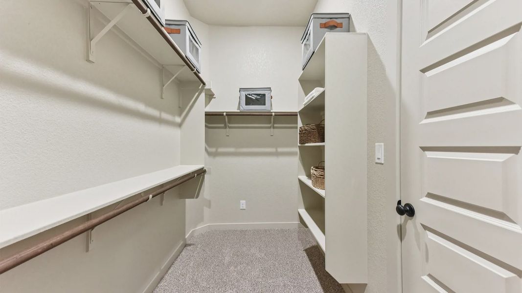 Representative furnished interior of a home built from the Peyton by Chesmar Homes in The Grove at Blackhawk, Pflugerville (Image 38).