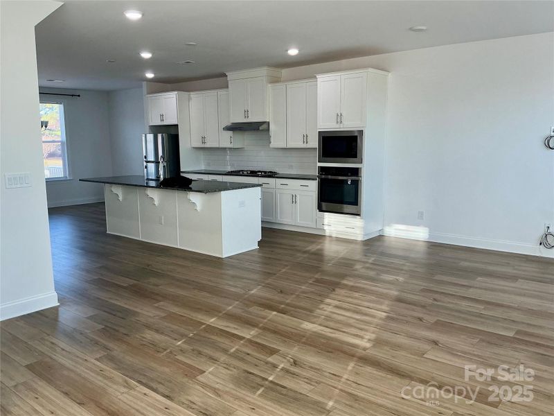 Beautiful flooring, quality cabinetry and granite countertops
