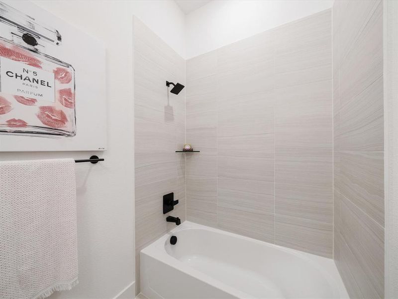 Full bath featuring shower / bathtub combination Full bath featuring shower / bathtub combination