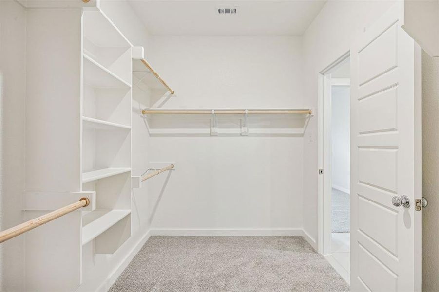 Primary Closet in the Stanley II home plan by Trophy Signature Homes – REPRESENTATIVE PHOTO