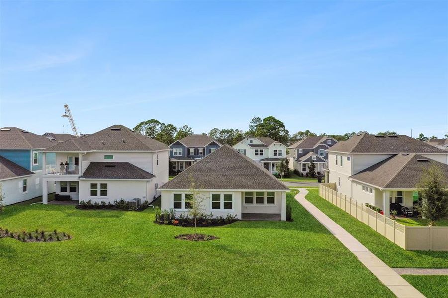 Front exterior of a new home in Northlake At Ovation, Winter Garden, FL, highlighting curb appeal (Image 2).