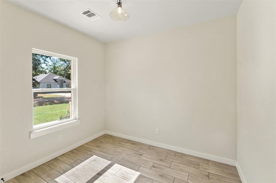 Neutral wall paint and trim complement wood-finish tile flooring Neutral wall paint and trim complement wood-finish tile flooring