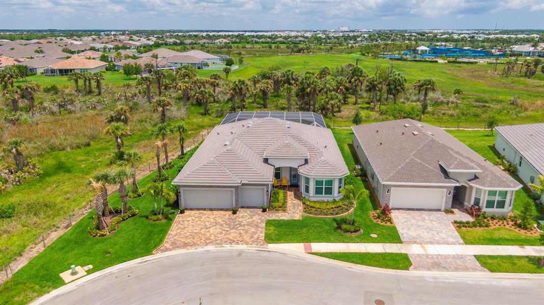 Front exterior of a new home in Del Webb Tradition, Port St. Lucie, FL, highlighting curb appeal (Image 20). Front exterior of a new home in Del Webb Tradition, Port St. Lucie, FL, highlighting curb appeal (Image 20).