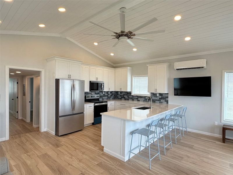 Kitchen with bar seating, all new appliances and softclose cabinets. Kitchen with bar seating, all new appliances and softclose cabinets.