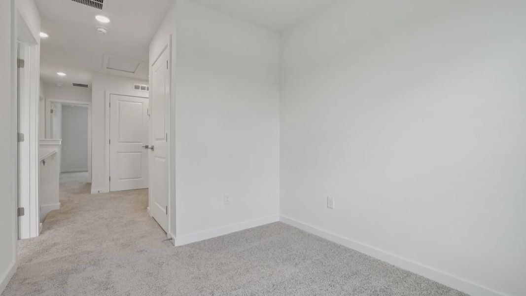 Upstairs Hallway of the Coronado - End at Cyrene at Harmony located in St Cloud FL by DRB Homes