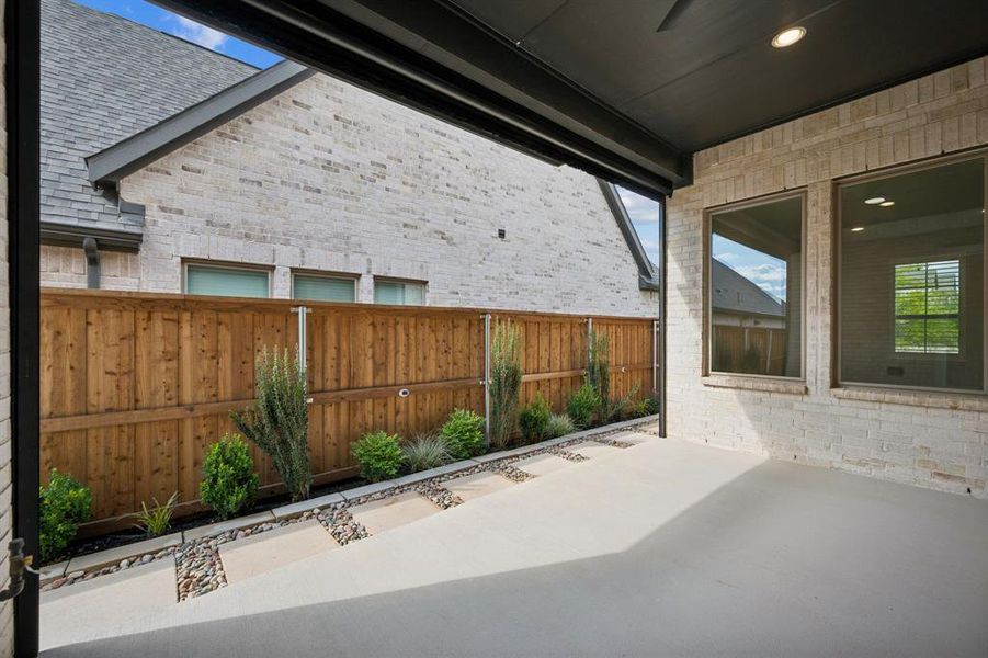 Covered patio featuring recessed lighting, a ceiling fan, a gas line for your grill, and a remote controlled sunshade.