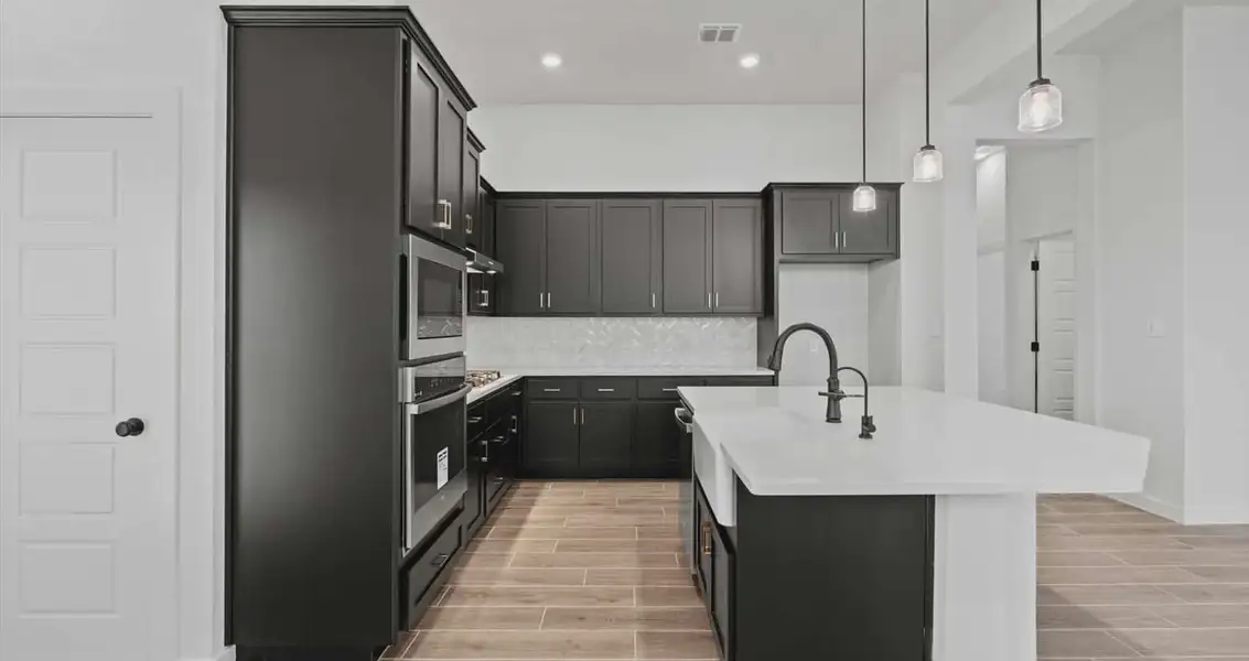 Representative furnished interior of a home built from the Rhyan by Chesmar Homes in Stream Waters, Buda (Image 4).