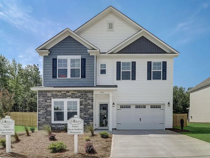 Front exterior of a new home in Providence Station at Trolley Run, Aiken, SC, highlighting curb appeal (Image 13). Front exterior of a new home in Providence Station at Trolley Run, Aiken, SC, highlighting curb appeal (Image 13).
