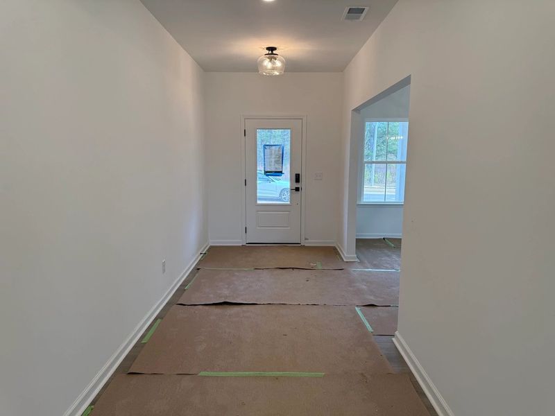 Foyer featuring the AW Collection® Artisan - A natural welcome with relaxed textures and grounded design. Foyer featuring the AW Collection® Artisan - A natural welcome with relaxed textures and grounded design.