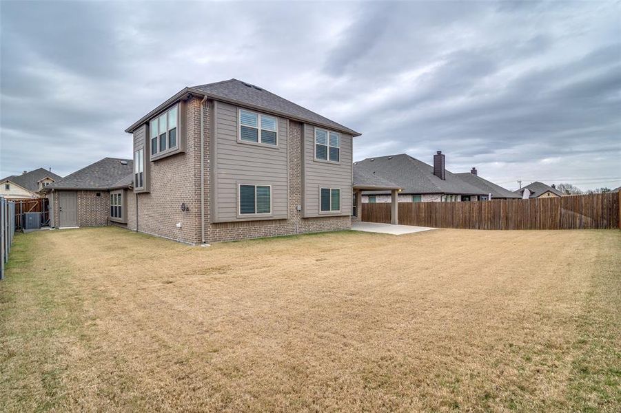 Rear view of house great sized yard and fully fenced!