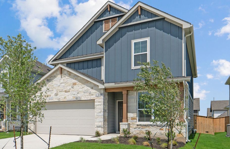 Front exterior of a new home in Patterson Ranch, Georgetown, TX, highlighting curb appeal (Image 21). Front exterior of a new home in Patterson Ranch, Georgetown, TX, highlighting curb appeal (Image 21).