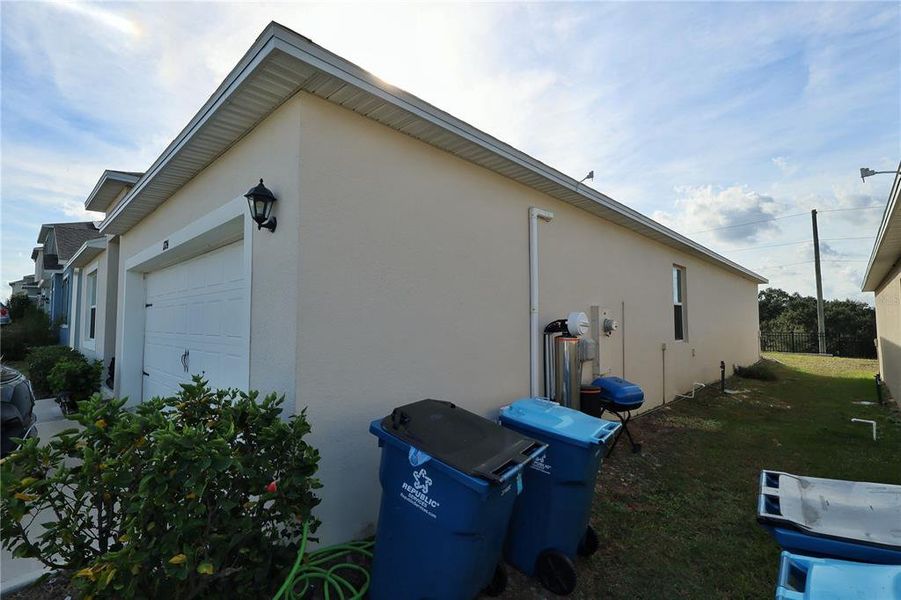 Exterior details and patio area of a home in Forest Lake, Davenport (Image 24).