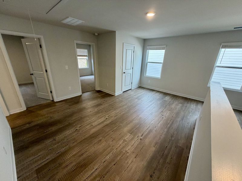 A room with wood floors. A room with wood floors.