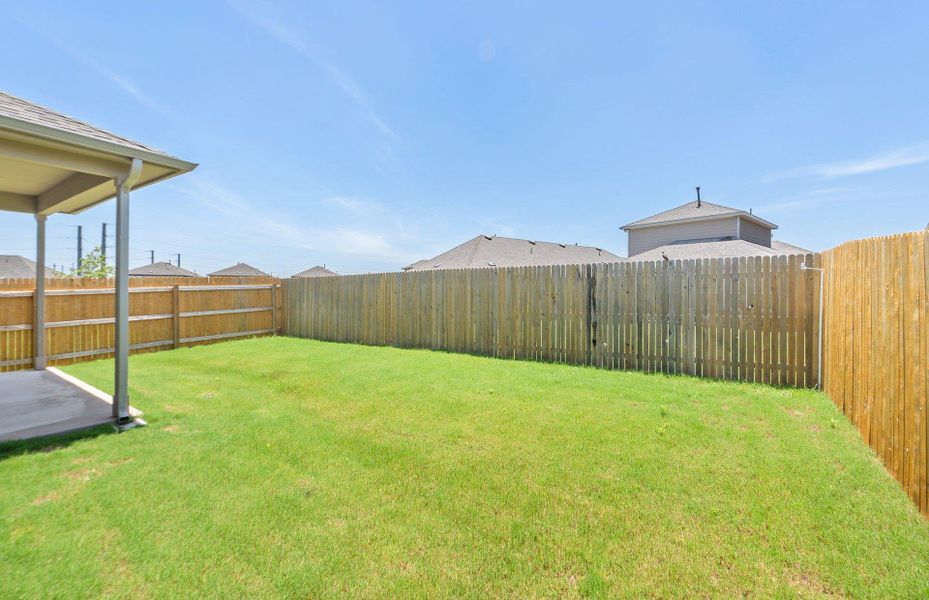 Exterior details and patio area of a home in Crosswinds, Kyle (Image 20).