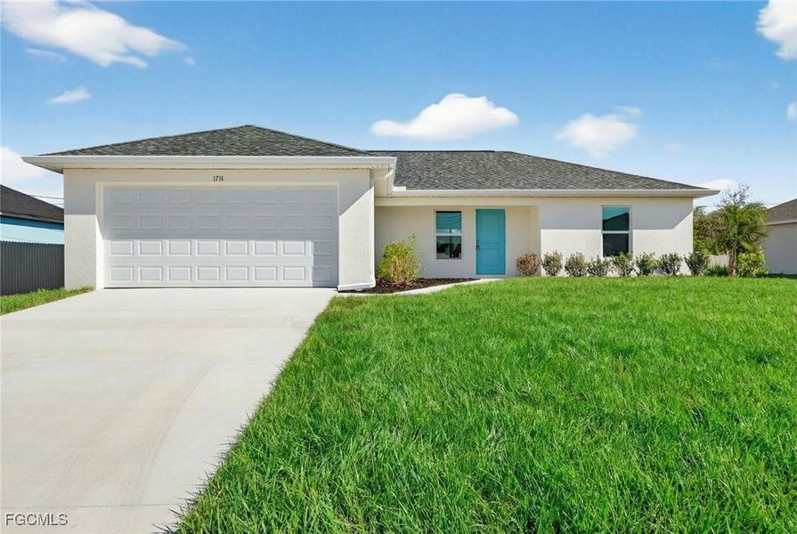 Front exterior of a new home in Cape Coral, Cape Coral, FL, highlighting curb appeal (Image 1). Front exterior of a new home in Cape Coral, Cape Coral, FL, highlighting curb appeal (Image 1).