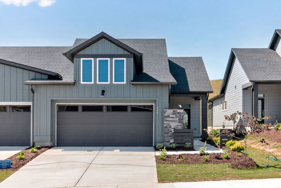 Front exterior of a new home in Encore at Chatham Park – Villa Series, Pittsboro, NC, highlighting curb appeal (Image 2). Front exterior of a new home in Encore at Chatham Park – Villa Series, Pittsboro, NC, highlighting curb appeal (Image 2).