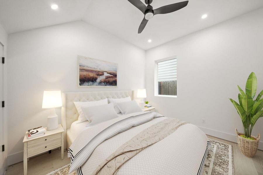 Located just off the foyer on the first floor, the third bedroom with ensuite bath has gorgeous hardwood floors, recessed lights, a ceiling fan with integrated light, a large window and a spacious walk-in wardrobe closet. his photo has been virtually staged.