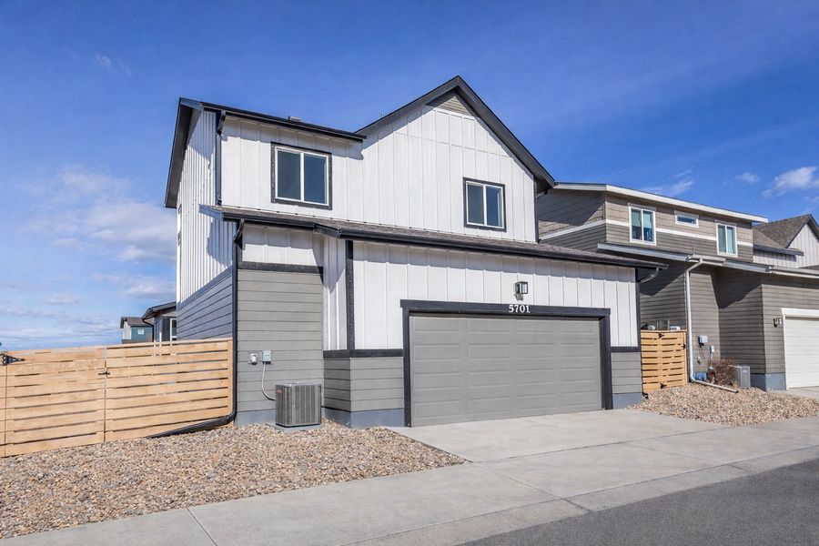 Front exterior of a new home in Trailside, Timnath, CO, highlighting curb appeal (Image 2). Front exterior of a new home in Trailside, Timnath, CO, highlighting curb appeal (Image 2).