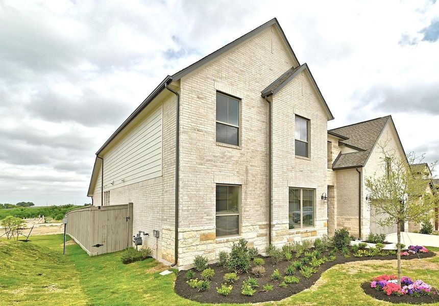 Front exterior of a new home in Flora - 60', Hutto, TX, highlighting curb appeal (Image 21).
