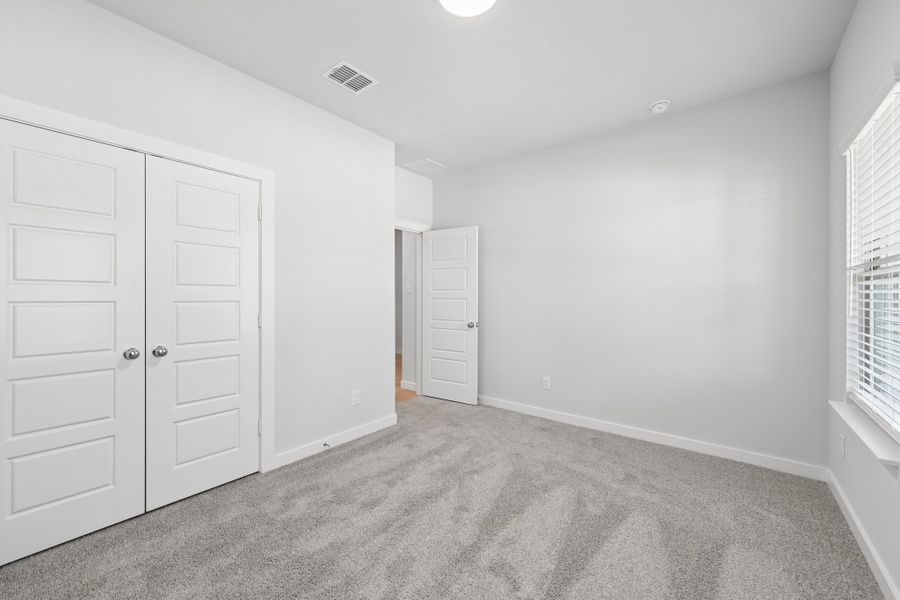 Bedroom in the Heisman home plan by Trophy Signature Homes Bedroom in the Heisman home plan by Trophy Signature Homes