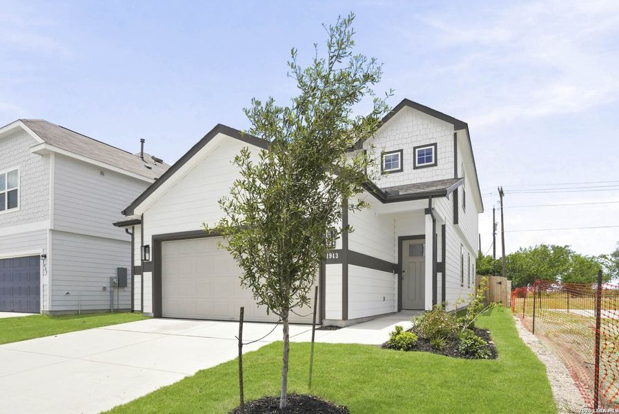 Front exterior of a new home in Dauer Ranch, New Braunfels, TX, highlighting curb appeal (Image 2). Front exterior of a new home in Dauer Ranch, New Braunfels, TX, highlighting curb appeal (Image 2).