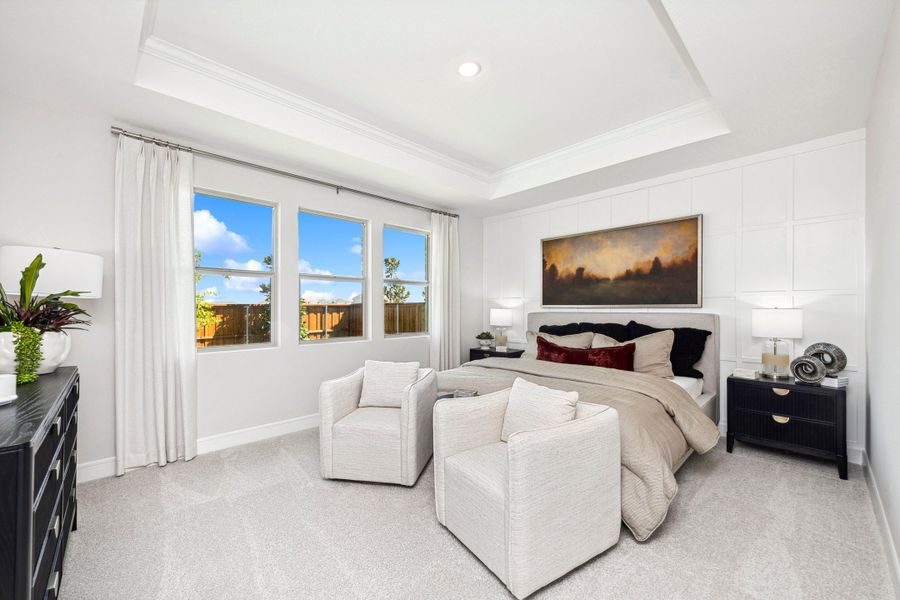 Primary suite with decorative feature wall Primary suite with decorative feature wall