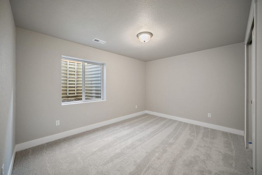 Spacious, unfurnished interior of a new home in The Glen, Colorado Springs (Image 31).