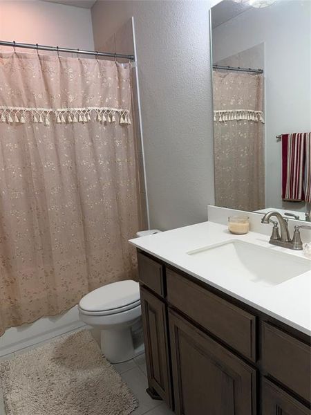 Bathroom vanity featuring a light-colored countertop, an integrated sink, and an oil-rubbed bronze finish faucet