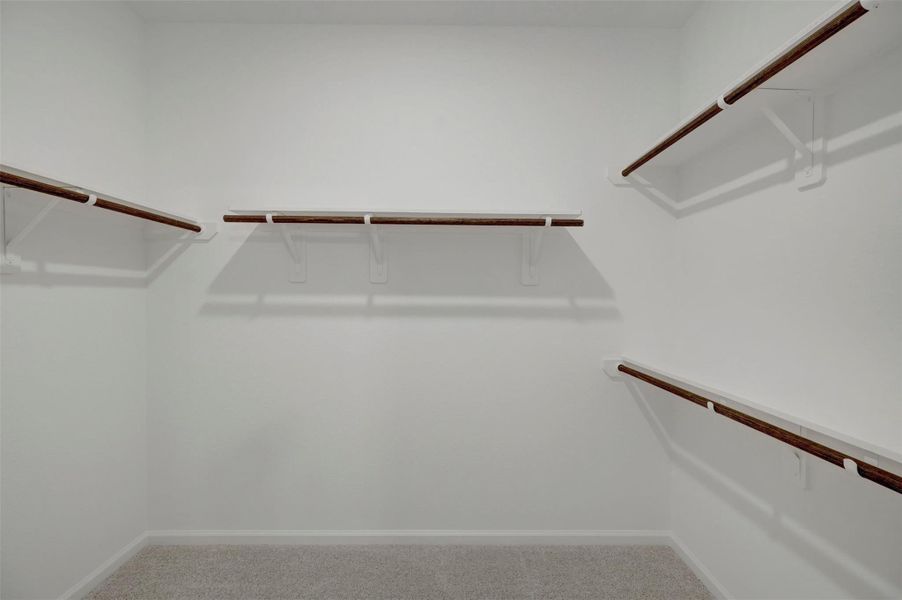 Primary walk-in closet Primary walk-in closet