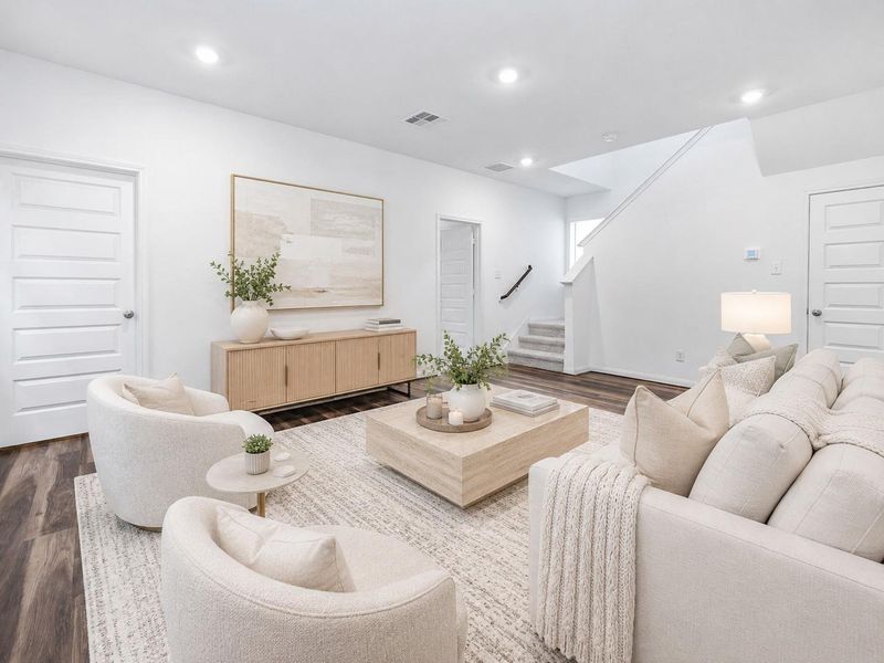 Spacious versatile family room, first floor, with a staircase leading to the 2nd. Virtually Staged Spacious versatile family room, first floor, with a staircase leading to the 2nd. Virtually Staged
