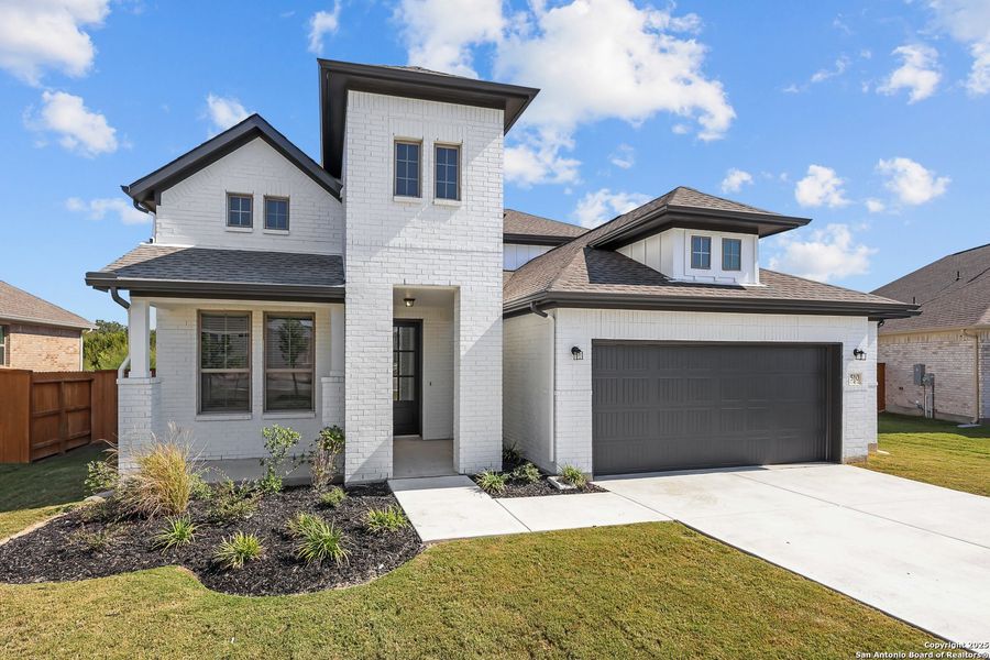 Front exterior of a new home in Foxbrook, Cibolo, TX, highlighting curb appeal (Image 1). Front exterior of a new home in Foxbrook, Cibolo, TX, highlighting curb appeal (Image 1).