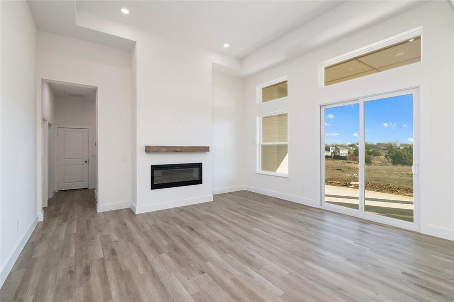 Unfurnished living room with light hardwood / wood-style flooring