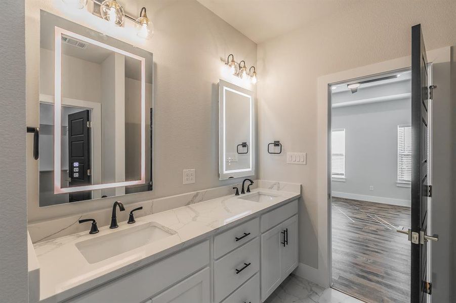 Bathroom featuring vanity and wood-type flooring