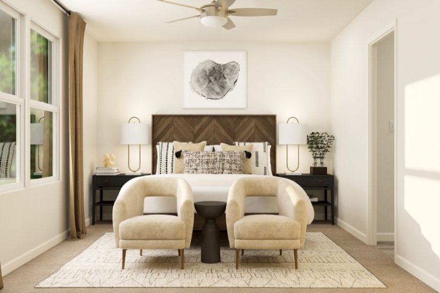 A room with a bed and chairs.