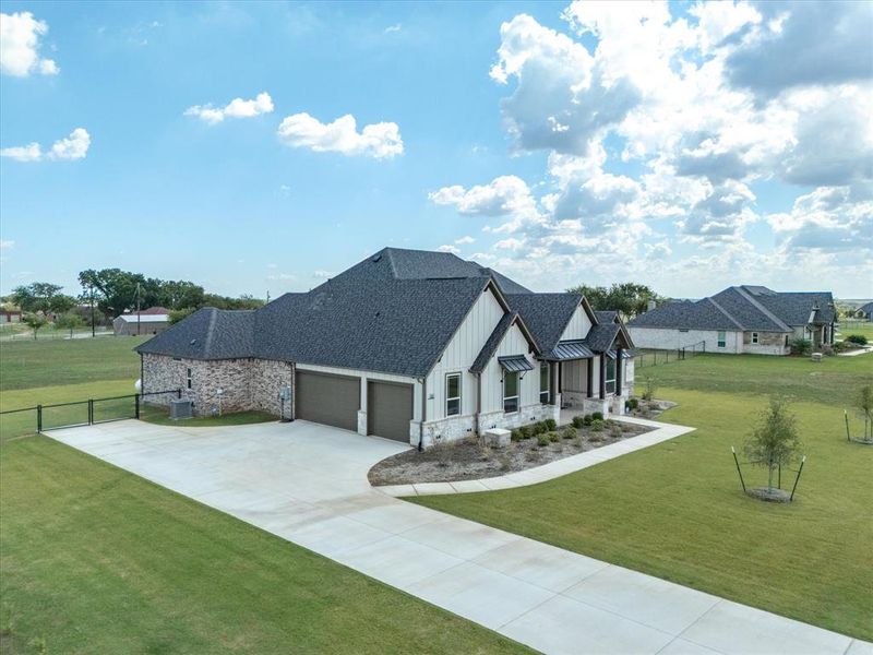 Front exterior of a new home in , Decatur, TX, highlighting curb appeal (Image 1).