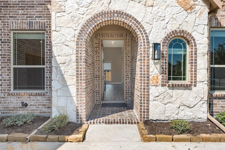 Front exterior of a new home in Villages of Walnut Grove, Midlothian, TX, highlighting curb appeal (Image 26). Front exterior of a new home in Villages of Walnut Grove, Midlothian, TX, highlighting curb appeal (Image 26).
