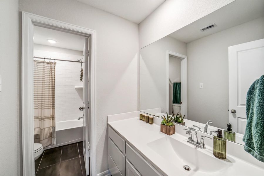 Secondary bathroom located upstairs