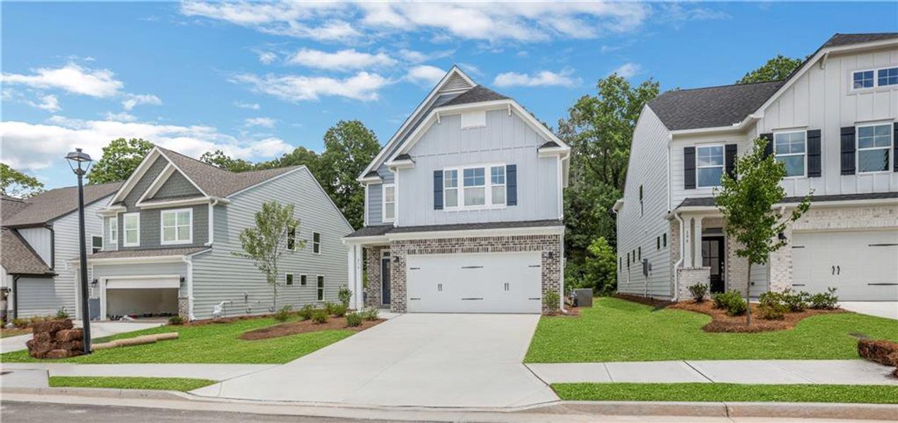 Front exterior of a new home in Villas at Dawsonville, Dawsonville, GA, highlighting curb appeal (Image 1). Front exterior of a new home in Villas at Dawsonville, Dawsonville, GA, highlighting curb appeal (Image 1).