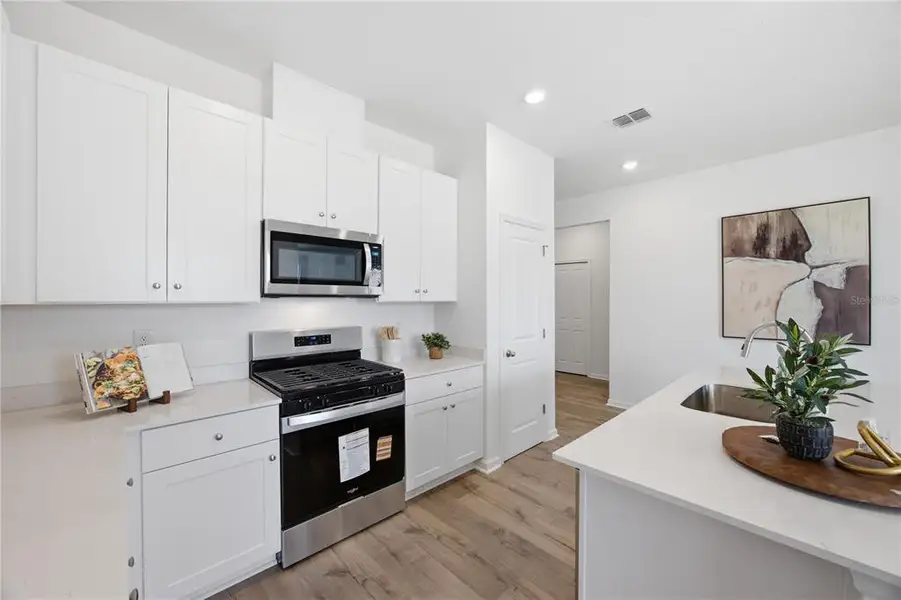 Furnished interior view inside a new home in , Okahumpka (Image 6).