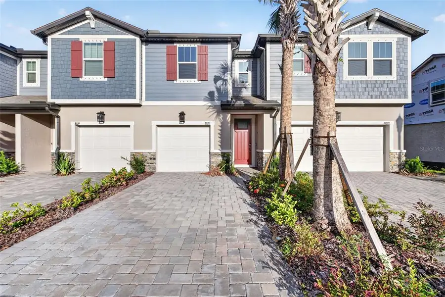 Front exterior of a new home in Crosswind Ranch, Parrish, FL, highlighting curb appeal (Image 2). Front exterior of a new home in Crosswind Ranch, Parrish, FL, highlighting curb appeal (Image 2).