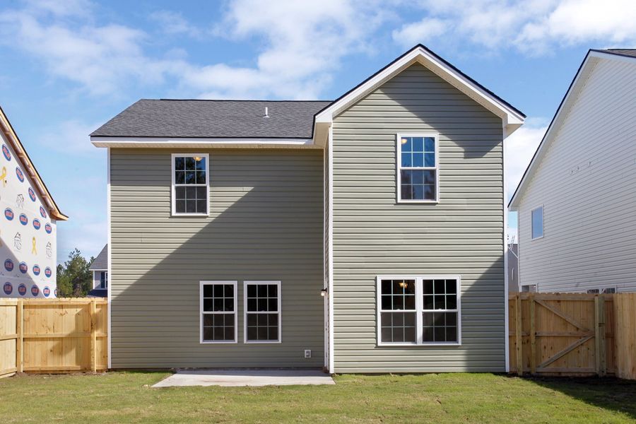 Representative exterior photo of a completed home built from the The Ryon by RTS Homes in Grand Reserve, Hinesville, GA (Image 23).