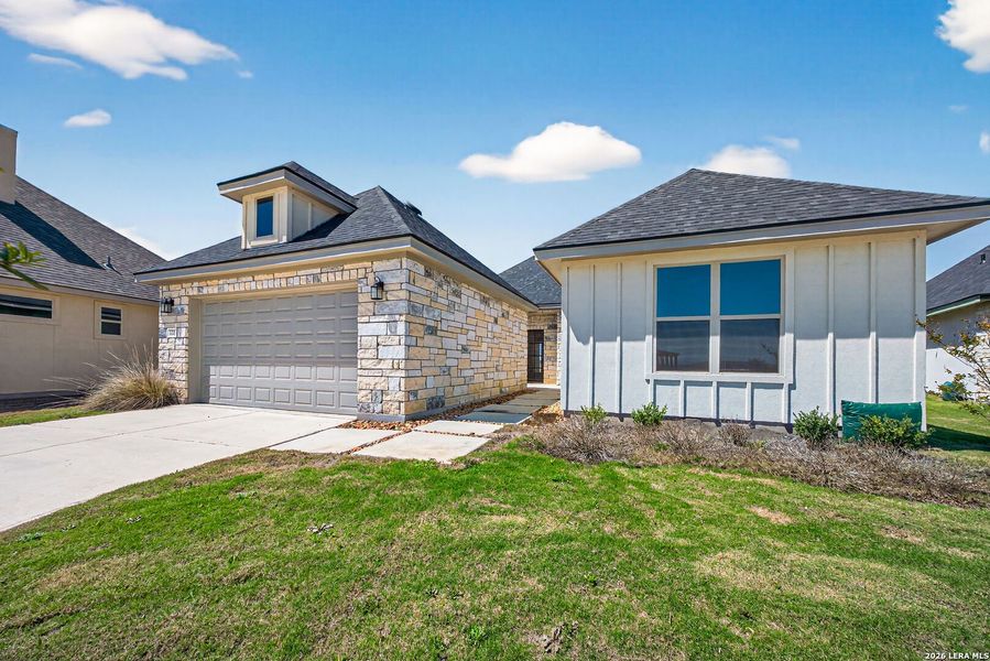 Front exterior of a new home in Boehme Ranch, Castroville, TX, highlighting curb appeal (Image 25).